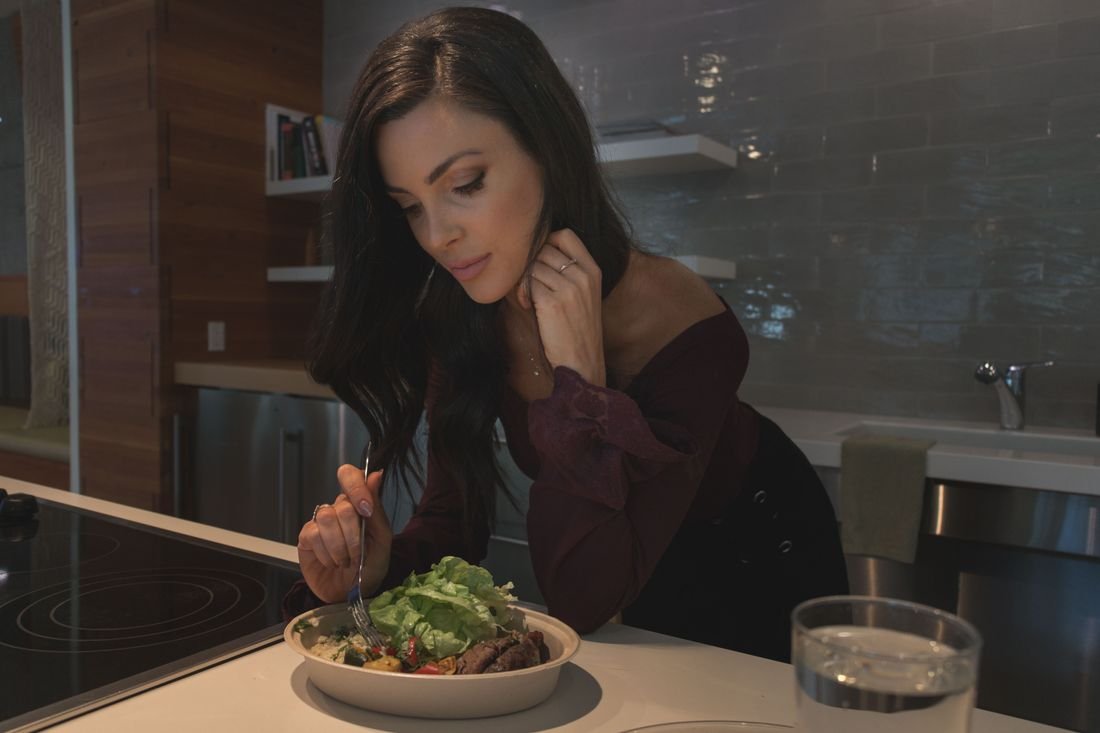 A woman eating a salad