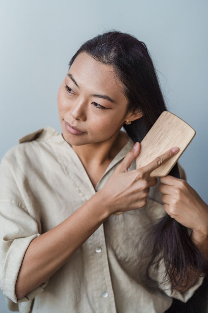 A woman brushing her long hair
